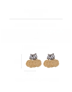 Detail view of vintage bohemian hammered gold earrings with marquise rhinestones
