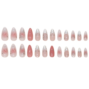 Sweet pink almond press-on nails with bow designs and silver glitter accents