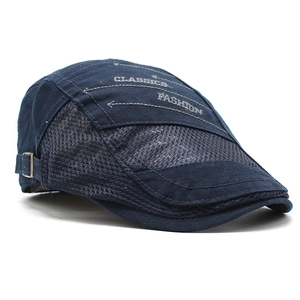 Detail of dark blue mesh beret with Classics embroidery and adjustable metal buckle strap