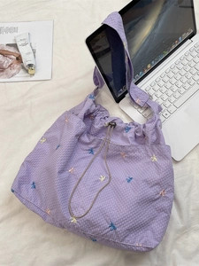 Purple checkered canvas shoulder bag with colorful butterfly embroidery and drawstring closure