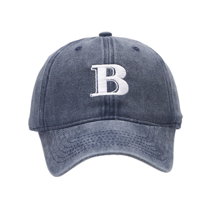 Retro washed denim baseball cap in dark blue featuring a large white 3D embroidered B letter