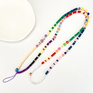 Detailed shot of colorful beaded phone strap with round beads and resin flower motifs