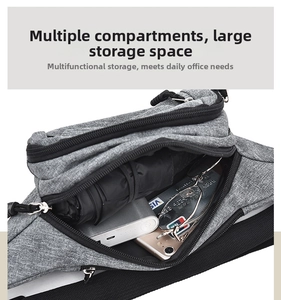 Close-up of grey fabric waist bag showing multi-layered compartments and large storage capacity