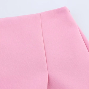 Close-up of side slit design and refined stitching on pink women's skorts