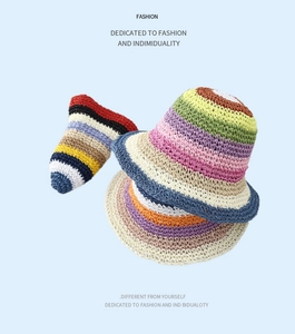 Macro detail of the colorful rainbow stripes and handmade woven texture on the bucket hat