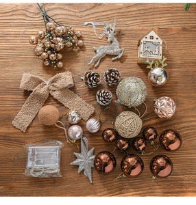 Detailed assortment of bronze and gold Christmas tree ornaments with LED lights and pine cones