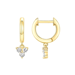 Close-up of gold hoop earrings featuring a three-stone clear zircon pendant detail