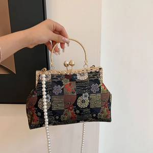 Elegant Chinese embroidery evening bag with golden handle, pearl clasp and chain strap