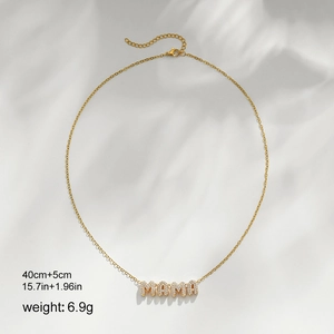 Detail of 18k gold MAMA letter necklace with cubic zirconia and size specifications