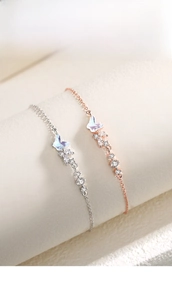 Détails de bracelets papillon en argent et or rose avec nacre colorée et zircons cubiques