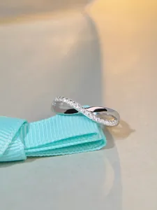 Close-up of S925 sterling silver infinity ring with sparkling micro-pave zircons
