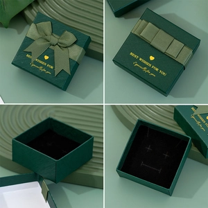Dark green jewelry gift box with ribbon bow and gold lettering for rings and necklaces