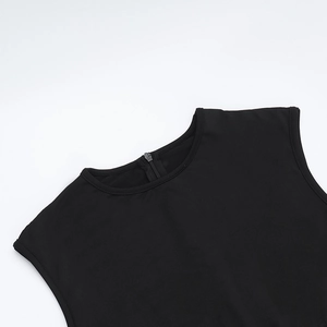 Close-up of the back neckline featuring a hidden zipper on the black mesh jumpsuit