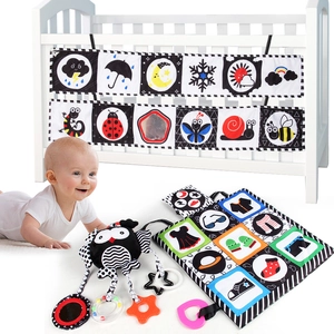 High contrast black and white baby cloth book with owl rattle and sensory teething toy