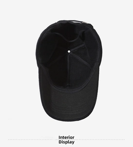 Detail view of black baseball cap interior showing reinforced seams and six-panel structure