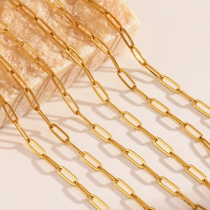 18K gold plated stainless steel paperclip chain necklace on a light stone surface