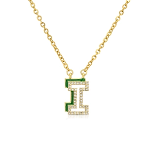 Macro shot of gold letter I pendant with green enamel and clear crystals on o-chain