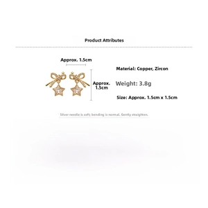 Detail view of zircon bow and star earrings with 1.5cm by 1.5cm dimension markings