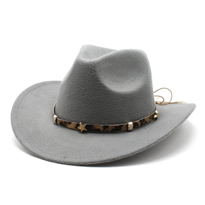 Detail of grey felt cowboy hat with leopard print band and gold star metal studs