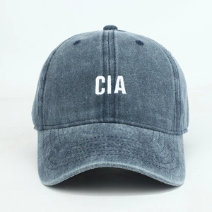 Close-up of CIA embroidery on dark gray washed cotton baseball cap with six-panel design