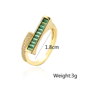 Detail view of 18K gold plated geometric ring with emerald zircon and size measurements
