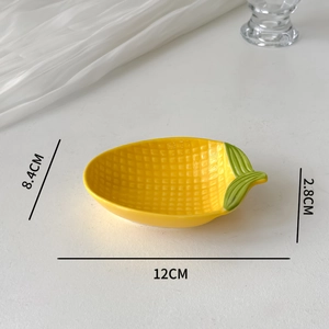 Macro view of lemon-shaped ceramic sauce dish with 12x8.4x2.8cm dimension markings