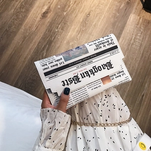 Fashionable PVC crossbody bag with vintage newspaper print and gold chain strap