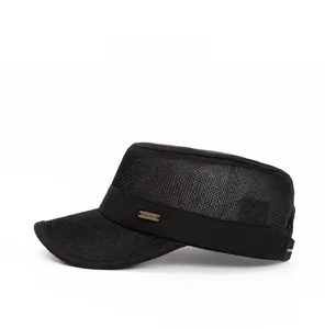 Side view of a black breathable mesh flat top hat with a metallic logo detail