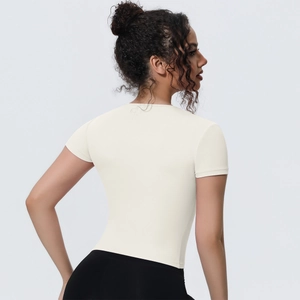 Rear view detail of slim fit breathable yoga t-shirt in cream white with short sleeves