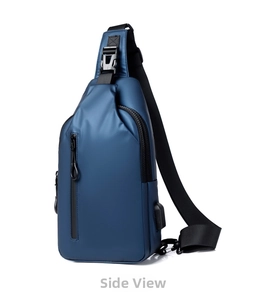 Close-up detail of the blue sling bag showing the USB charging port and zipper pocket.