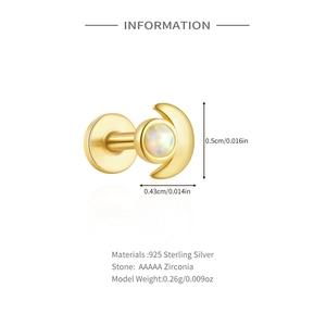 Detail of gold crescent moon earring in 925 sterling silver with opal and zirconia