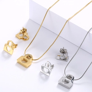 Fashion heart locket necklace and earrings jewelry set in gold and silver steel finish