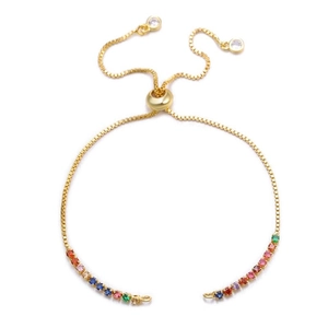 Detail of adjustable gold-plated slider bracelet with rainbow cubic zirconia inlay