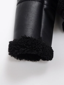 Detail of sleeve cuff on black double-sided fleece jacket with leather texture