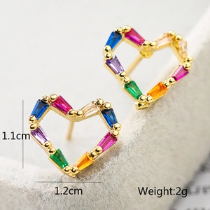 Detailed macro view showing the 1.1cm by 1.2cm dimensions of colorful heart stud earrings