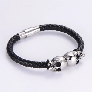 Punk black braided leather bracelet for men with steel skulls and magnetic clasp
