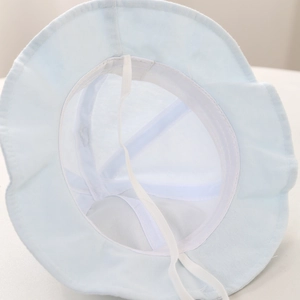 Detail of baby sun hat with breathable mesh lining and adjustable white windproof drawstring