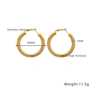 Detail of 40mm gold hollow hoop earrings showing 5mm width and high polished finish
