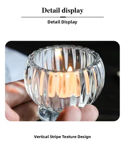 Detailed macro view of the vertical ribbed glass texture on the elegant candle holder