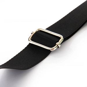 Detail of silver metal adjustment buckle and black woven strap on a transparent crossbody bag