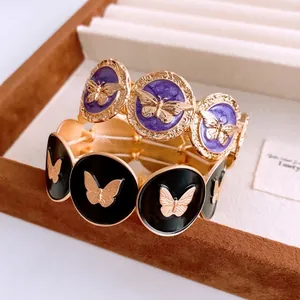 Vintage style gold butterfly stretch bracelet set with purple and black embossed charms