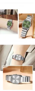 Detail view of square women watch featuring green dial and silver steel bracelet