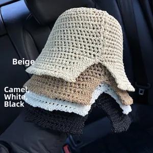 Detail showing hollow crochet knit texture of summer bucket hats in four assorted colors