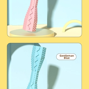 Detail view of pink and blue hexagonal pet chew sticks with dental cleaning textures