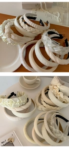 Macro detail of various cream-colored headbands including pleated and braided fabric textures