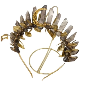Golden leaf crown headband with raw grey crystal quartz and moon pendant on white background