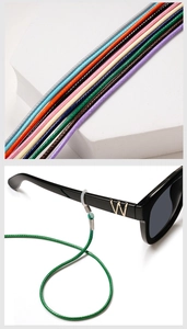 Close-up of woven eyeglass cords in various colors with anti-slip silicone loops