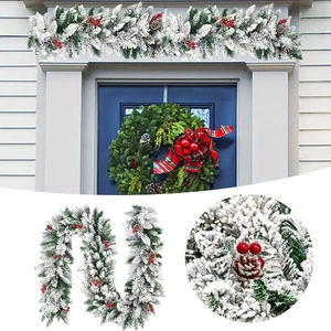 Macro detail showing artificial snow, red berries and pine cones on Christmas garland