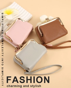Three lychee texture coin purses in pink, brown and gray with wrist straps and metal kiss locks