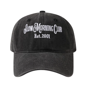 Washed dark gray baseball cap with white Slow Morning Club embroidery and curved brim